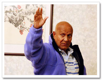 Sri Chinmoy waves to his students